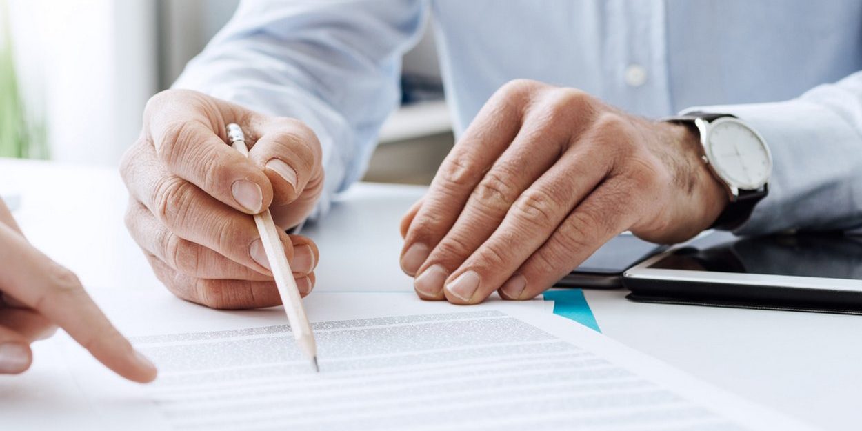 Business people negotiating a contract