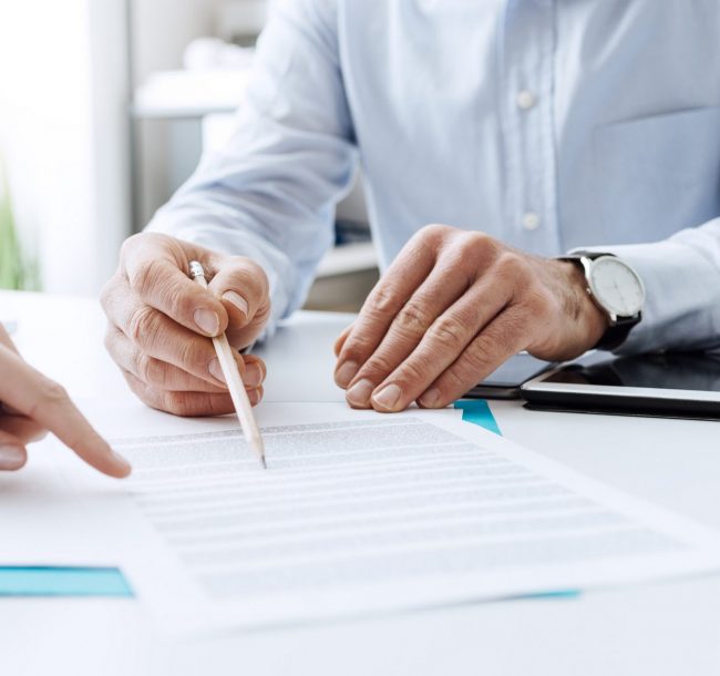 Business people negotiating a contract